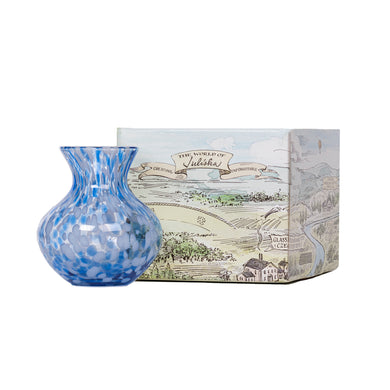 Juliska Puro Blue Vase 6 inch glass spotted with white and blue in front of Juliska product box