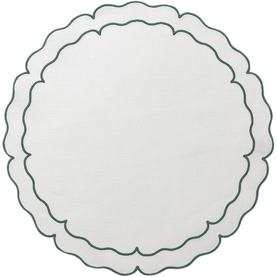 white placemat with embroidered green scalloped border