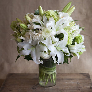 sympathy floral arrangement white ranunculus lilies green hydrangeas