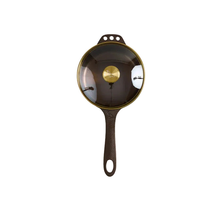 Cast iron skillet with a black handle
