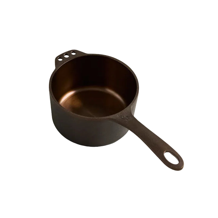 Cast iron pot on a light gray background