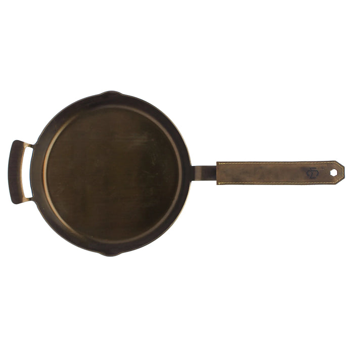 black carbon steel frying pan with brown leather handle cover