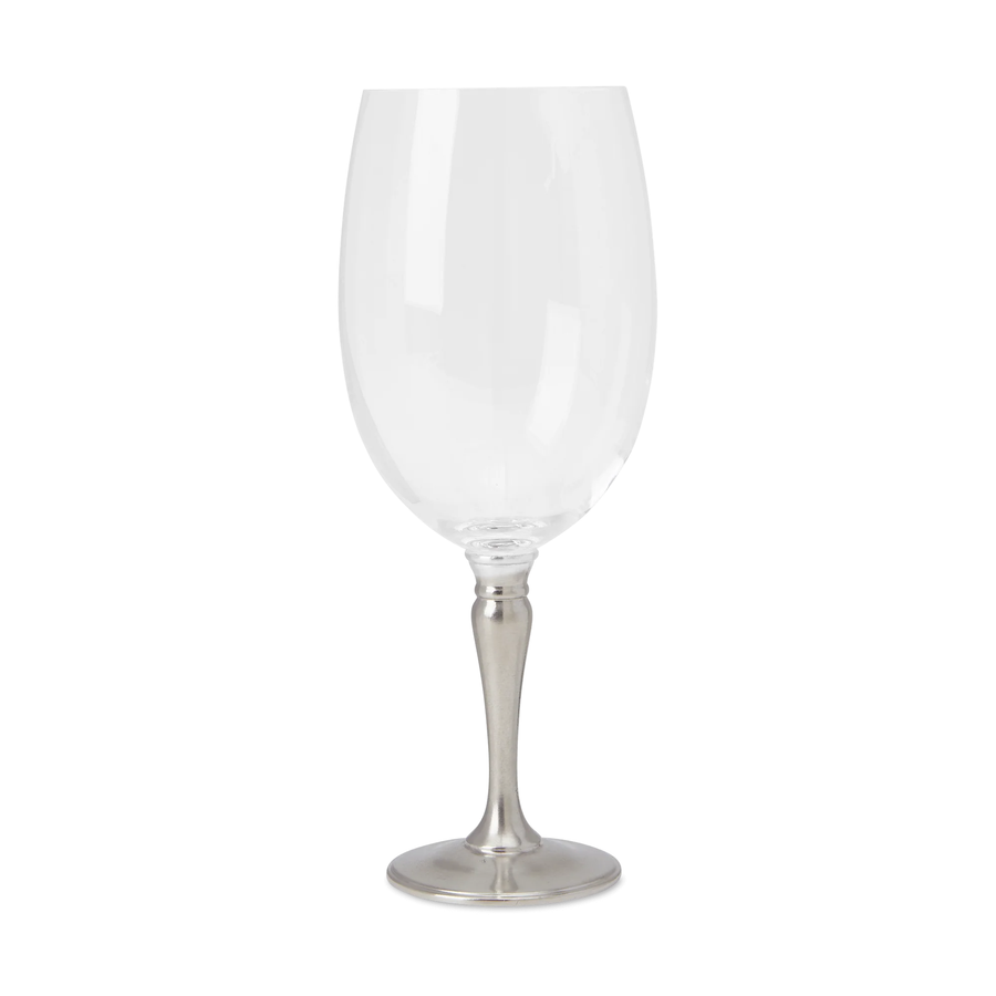 a large wine glass with a pewter stem