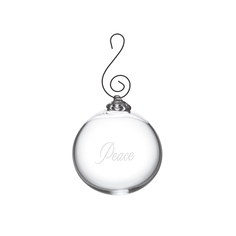 A clear glass Christmas ornament shaped like a round bauble with a black wire hanger and the year '2026' engraved on the front, shown on a plain white background.