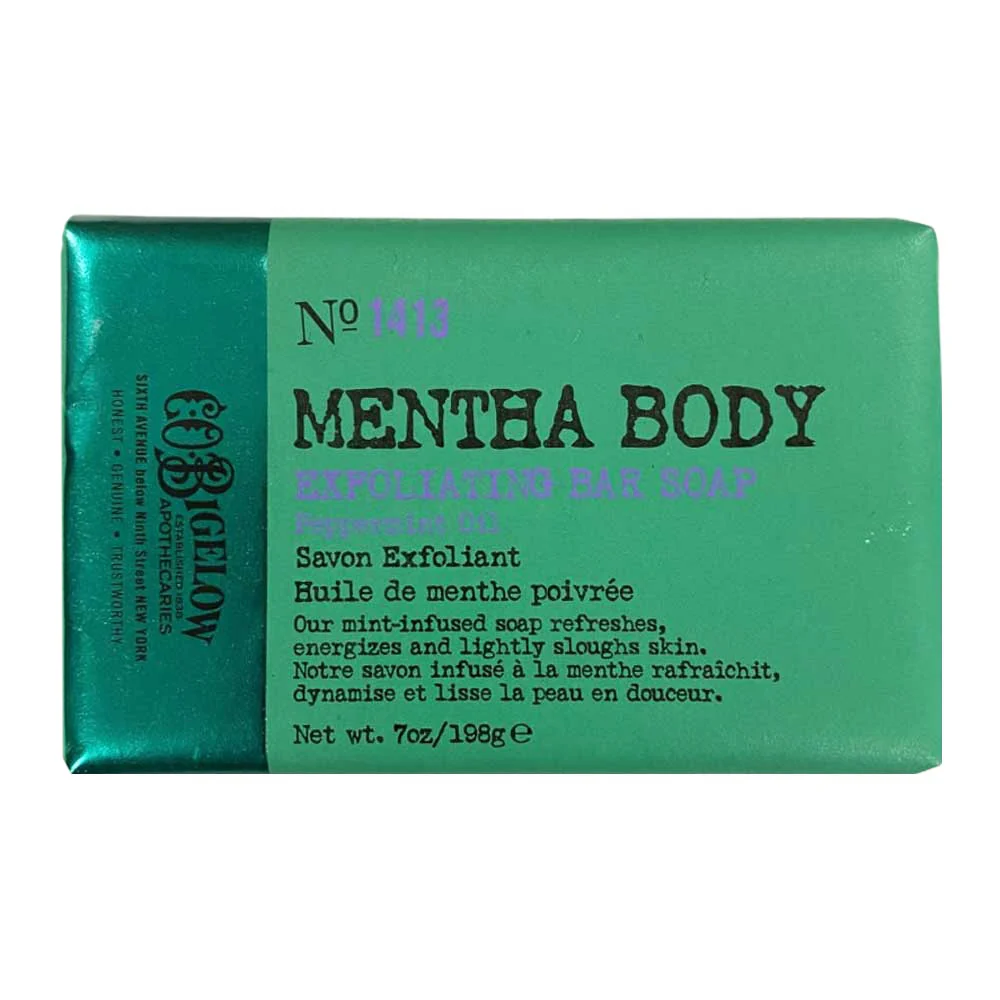 Green soap bar wrapped in green paper that reads "Mentha Body Exfoliating Bar Soap"