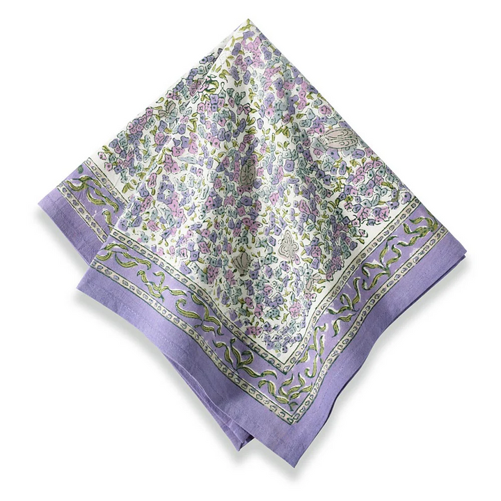 a lavender floral patterned linen with a purple border