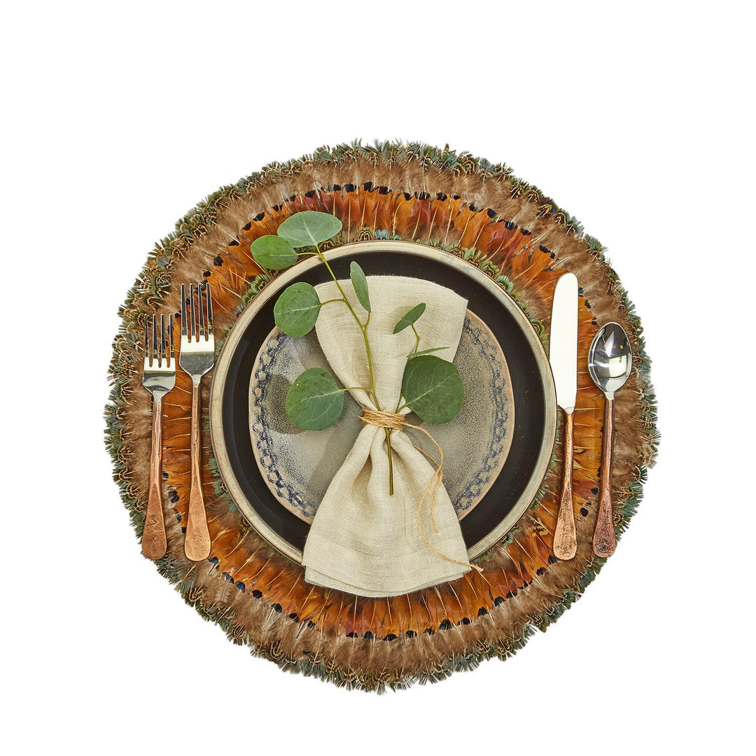 Place setting with feather placemat
