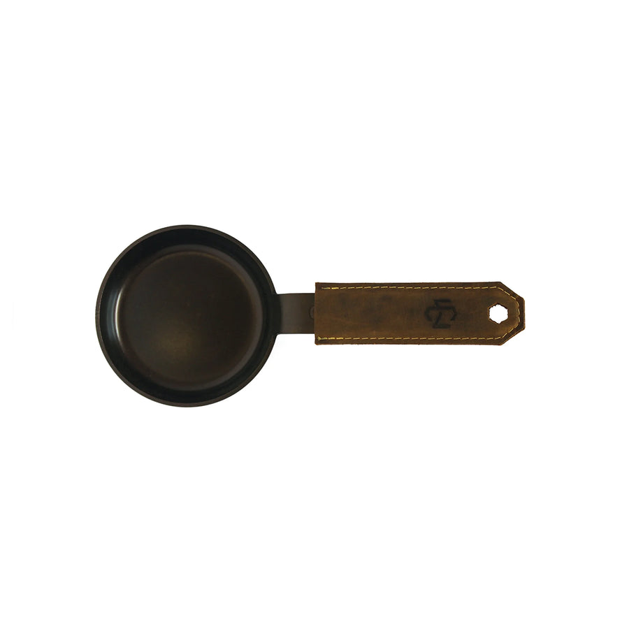 small carbon steel pan with brown leather handle cover