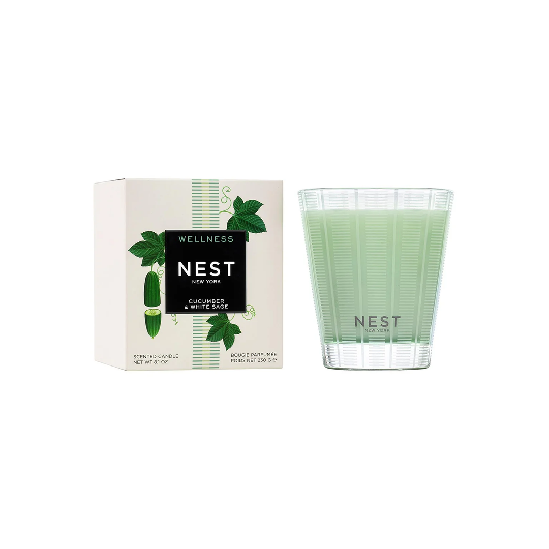 Green Nest cucumber and white sage candle next to its packaging