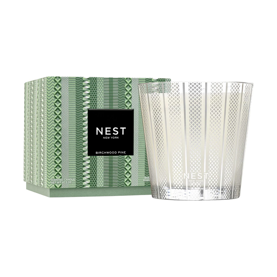 NEST birchwood pine candle with decorative box on a white background