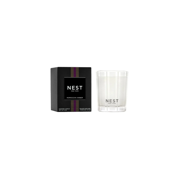 Nest Moroccan Amber votive candle next to its box