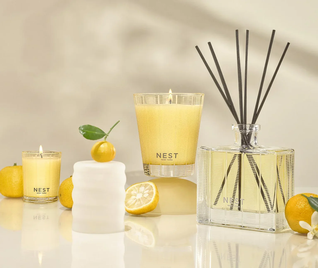 NEST sunlit Yuzu and Neroli votive and classic candles and a diffuser featuring decorative yuzu
