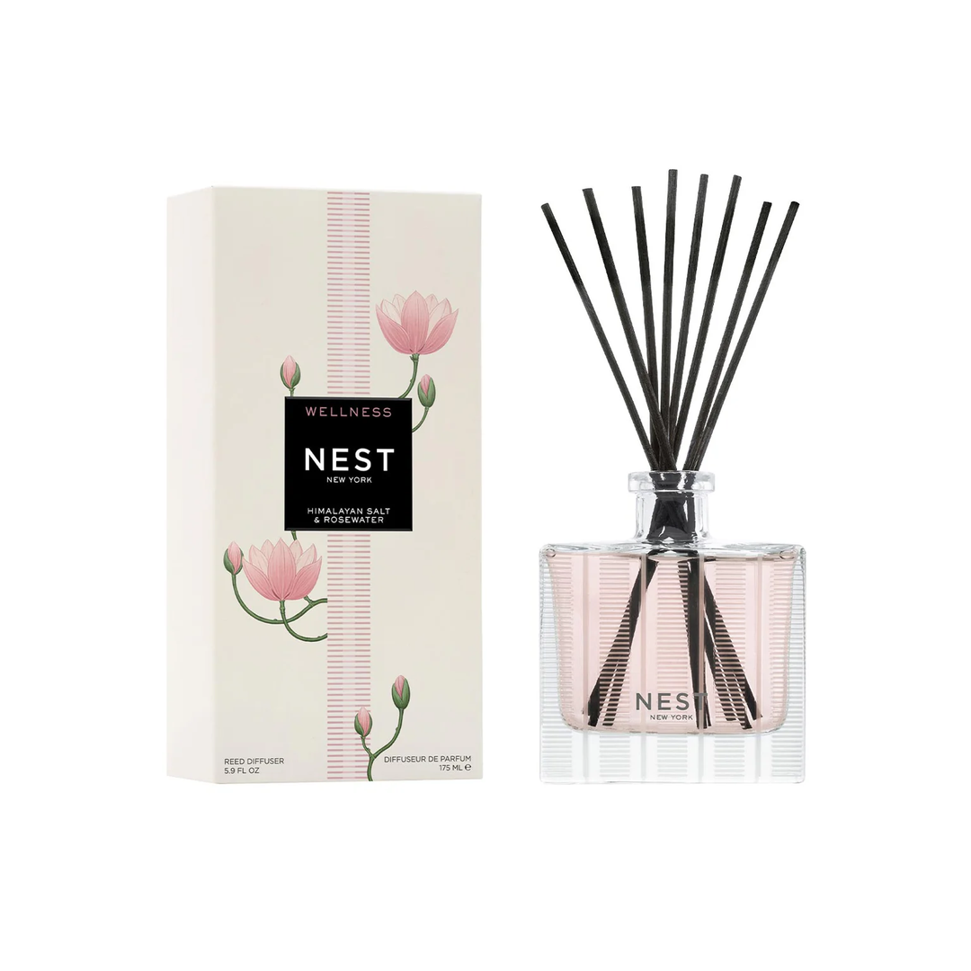 Nest Himalayan Salt and rosewater diffuser with packaging featuring pink lotus flowers on a white background