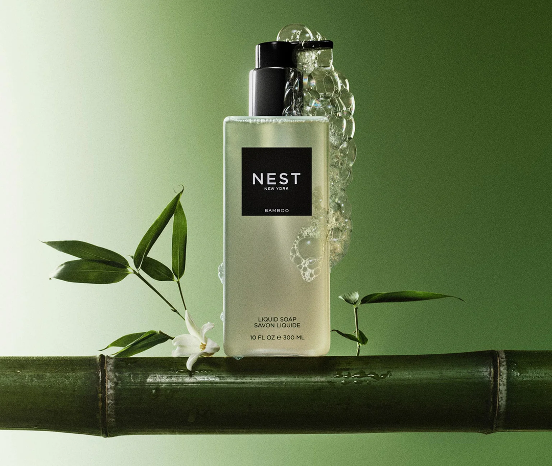 NEST New York Bamboo liquid soap bottle with bamboo branch and leaves on a green background
