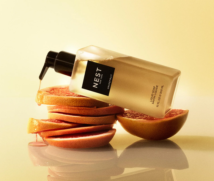 Nest grapefruit liquid soap set on top of slices of grapefruit