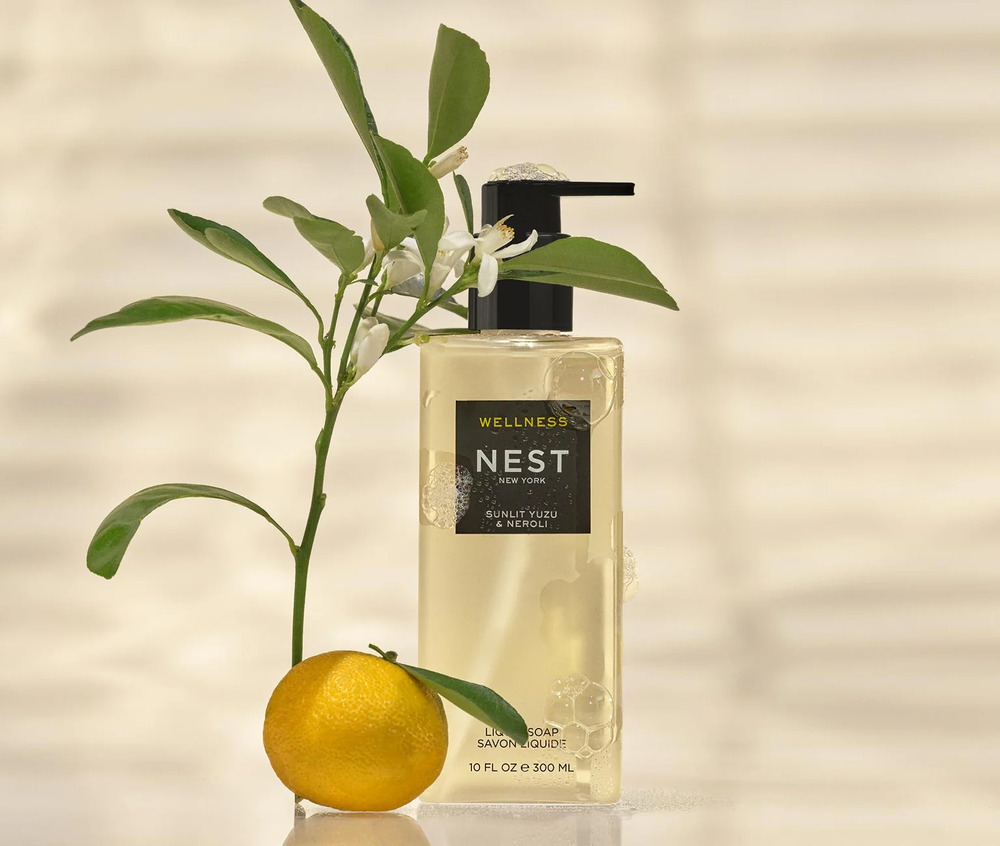 Nest Wellness Sunlit Yuzu and Neroli liquid soap bottle with a yuzu and leaves 