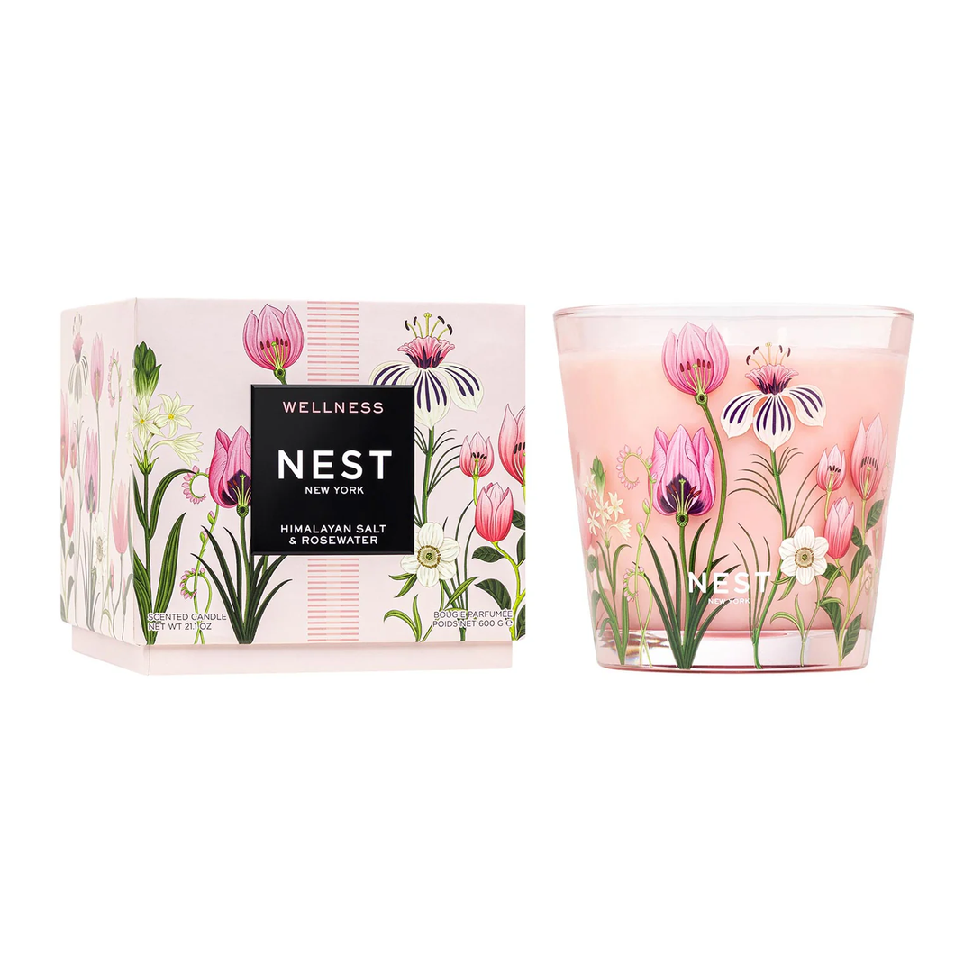 A decorative Nest Himalayan Salt and Rosewater 3 wick candle next to its box