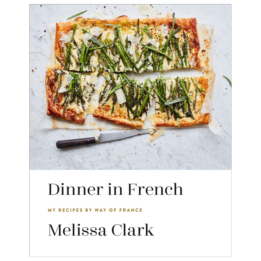 Book cover of 'Dinner in French' by Melissa Clark with a pastry dish on marble.
