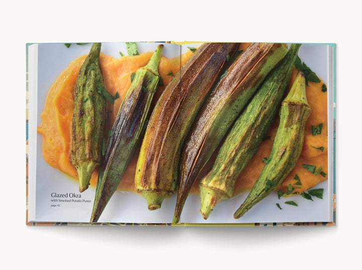 A book open to a two page spread of a photo of glazed okra