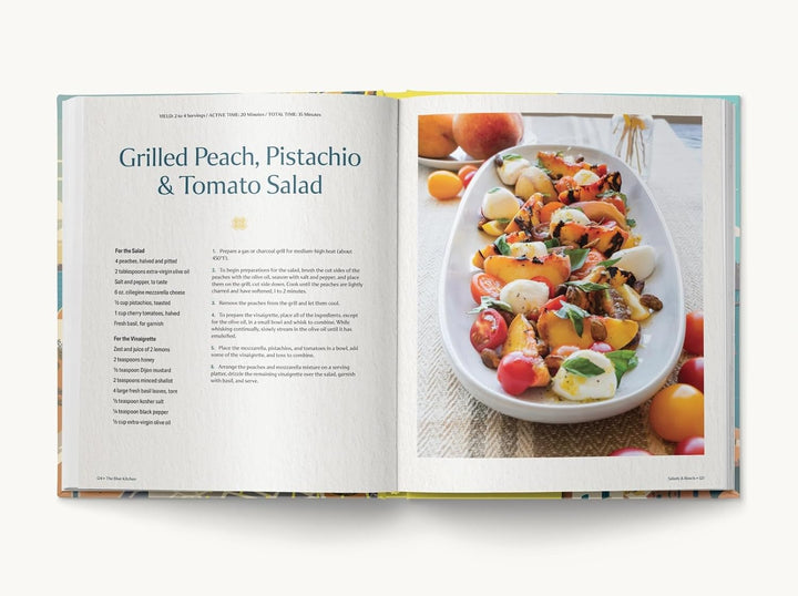 A recipe book oprn to a page for Grilled peach, pistachio, and tomato salad