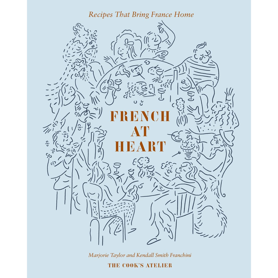 A light blue book cover titled "french at heart: recipes that bring france home" by marjorie tayler and kendall smith franchini