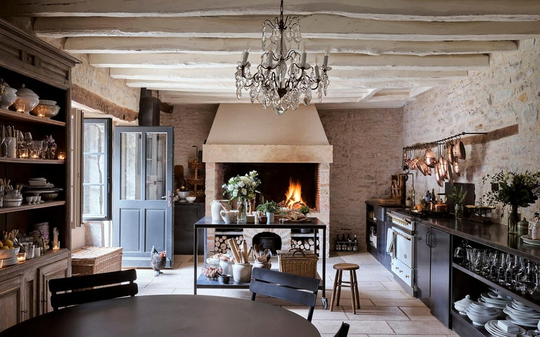 An image of a kitchen with a wood burning fireplace 