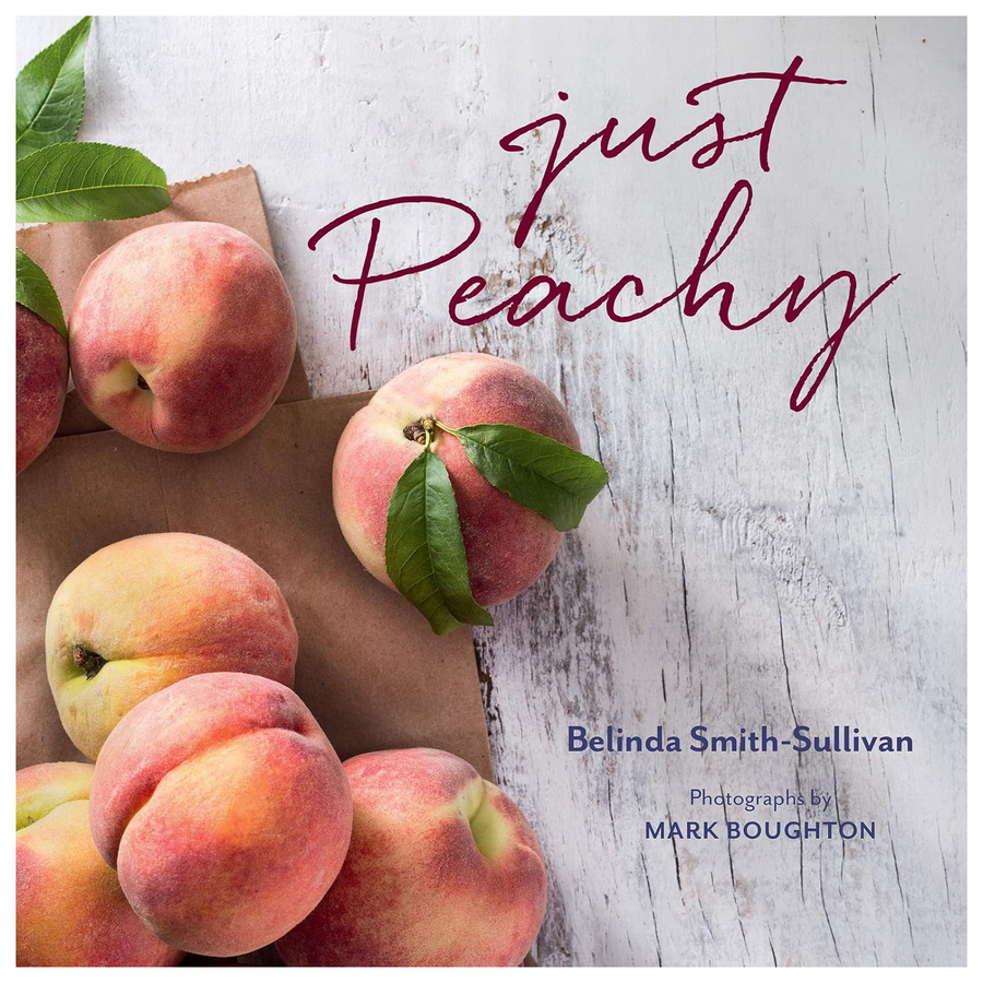 Book cover of 'Just Peachy' with peaches and a wooden board on a light wood background.