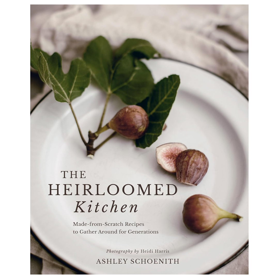 Book cover of 'The Heirloomed Kitchen' with figs on a plate