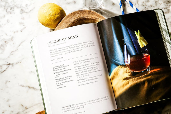 A recipe beook open to a cocktail called "Cleme my mind"