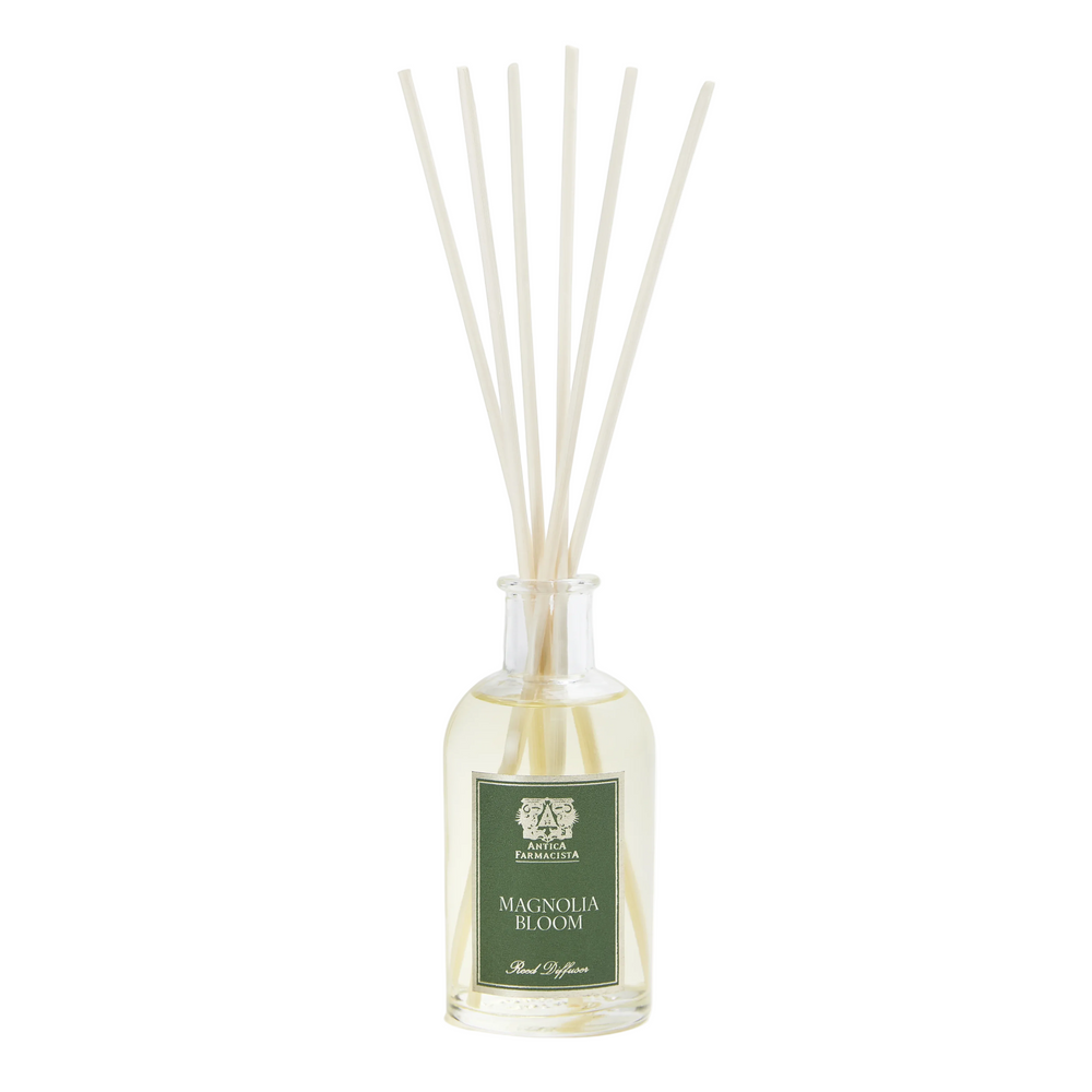 Diffuser bottle with reeds labeled 'Magnolia Bloom'