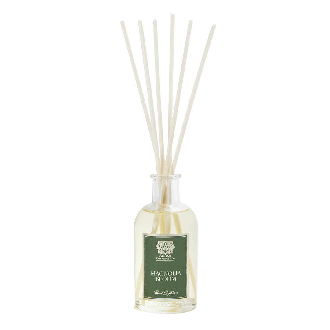Diffuser bottle with reeds labeled 'Magnolia Bloom'