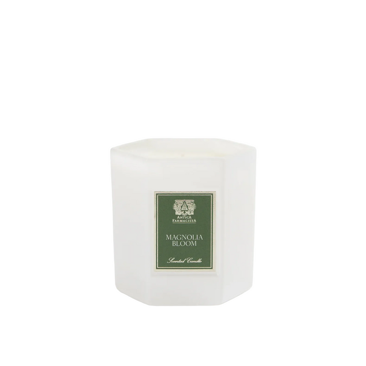 White candle with a green label