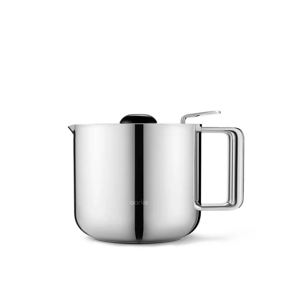 A stainless steel electric kettle with a rounded body, a rectangular handle, a pouring spout, and a black lid, shown on a clean white background.