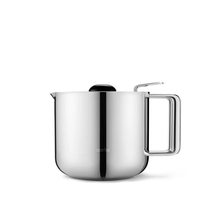 A stainless steel electric kettle with a rounded body, a rectangular handle, a pouring spout, and a black lid, shown on a clean white background.