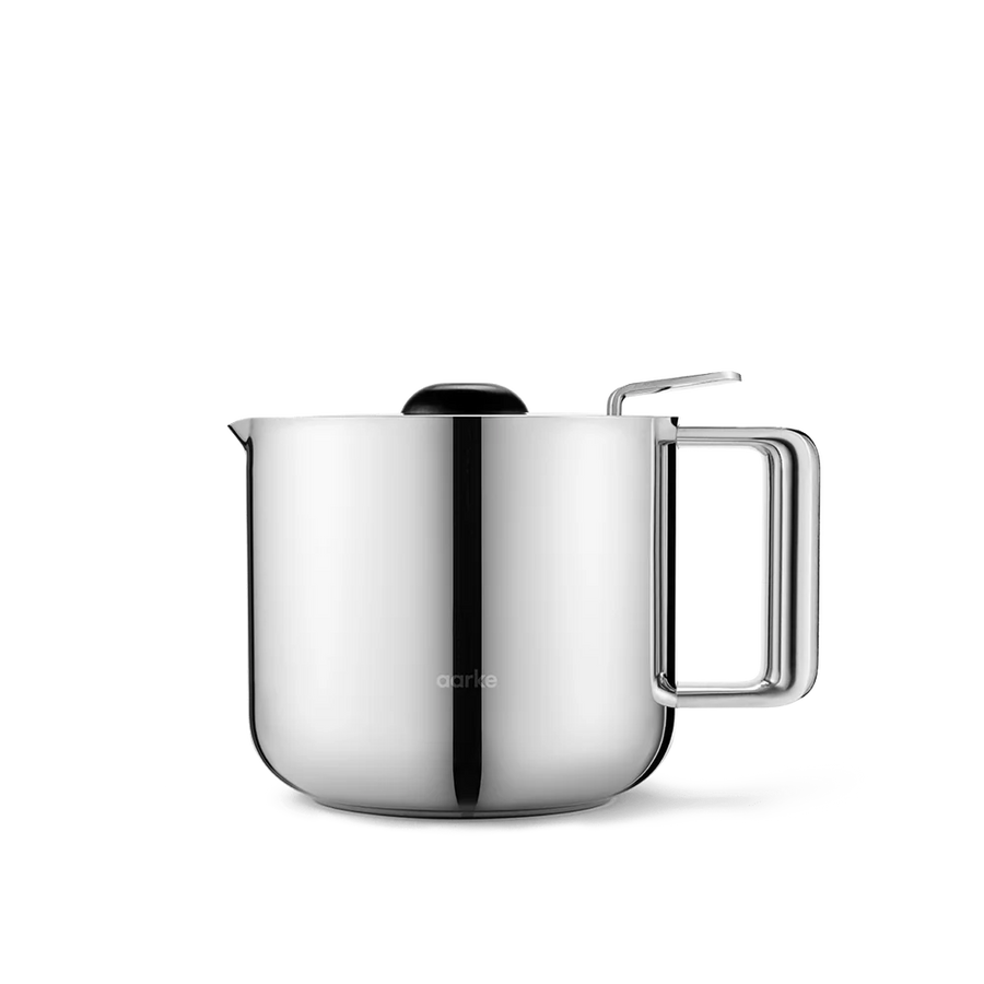 A stainless steel electric kettle with a rounded body, a rectangular handle, a pouring spout, and a black lid, shown on a clean white background.