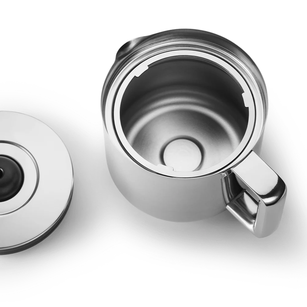 A stainless steel travel mug shown open with its lid placed beside it on a clean white background.