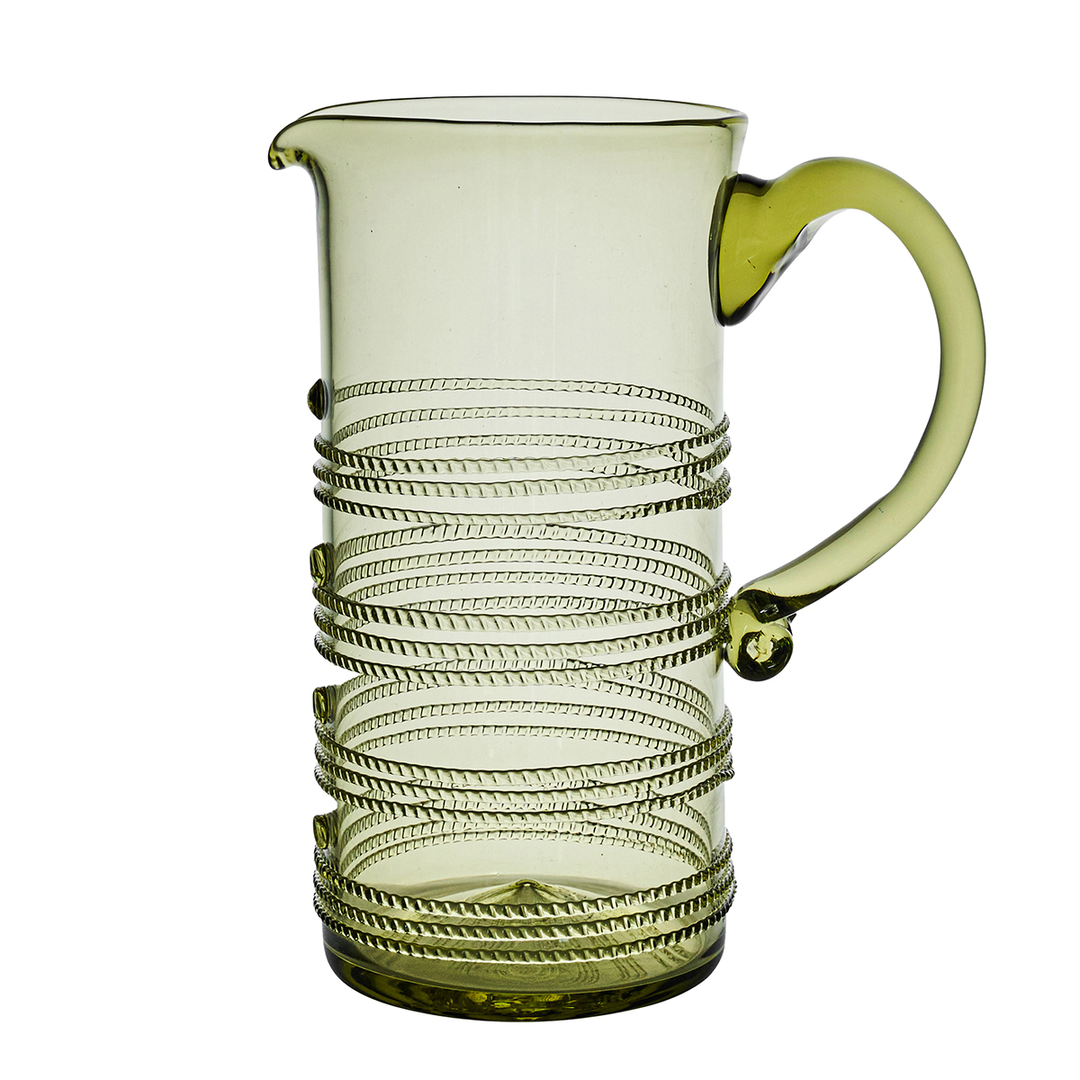 A ribbed clear glass pitcher with a matching green-tinted handle and spout, featuring a coiled spiral pattern wrapped around the lower half, shown on a white background.