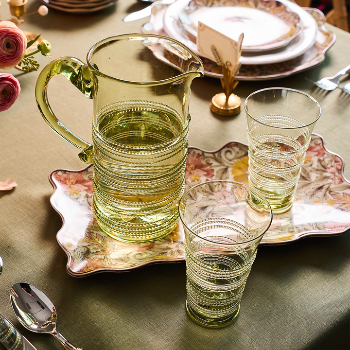 a table with pitchers and glasses and a tray and stuff