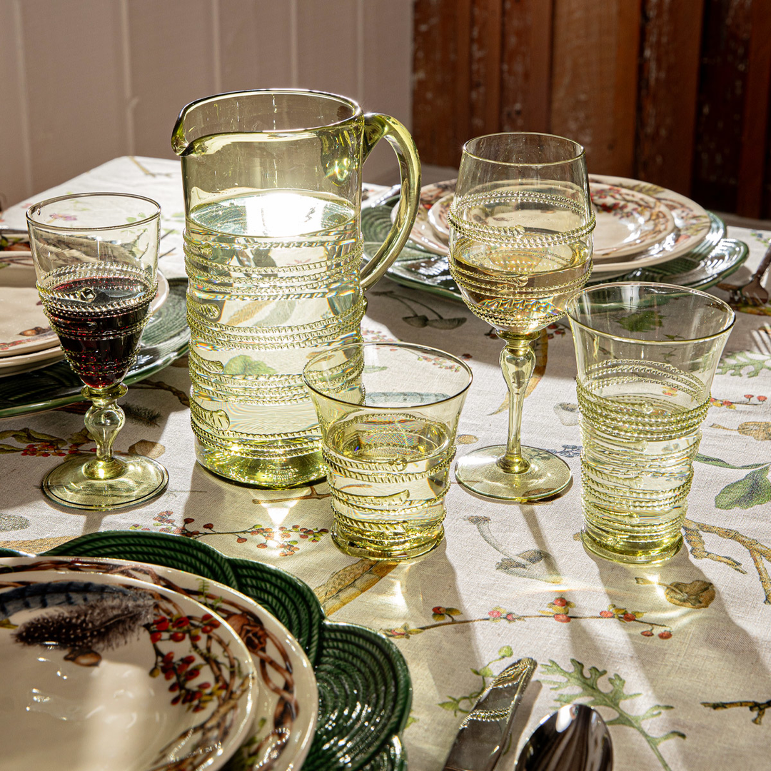 a table wtih a pitched and glasses and stuff