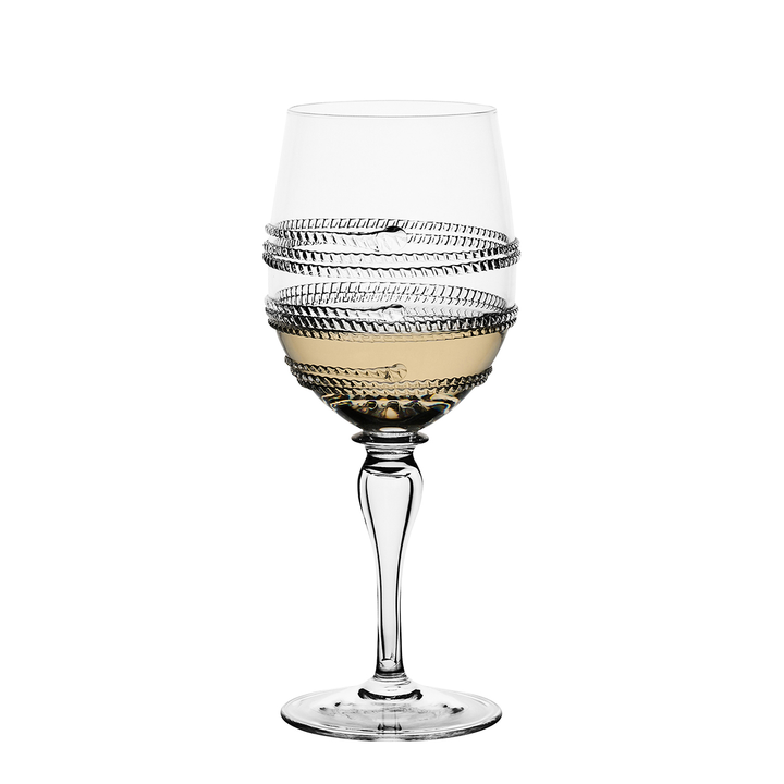 Decorative wine glass with intricate design on a white background