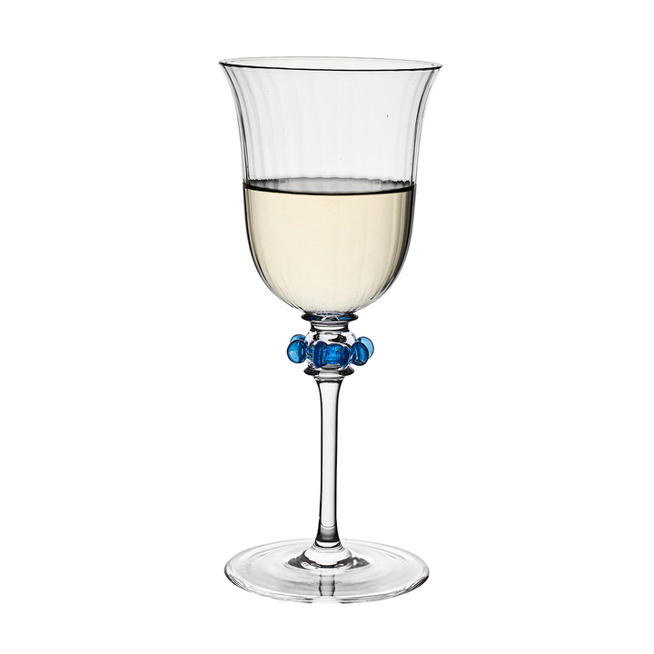 Clear wine glass with blue decorative elements on a white background