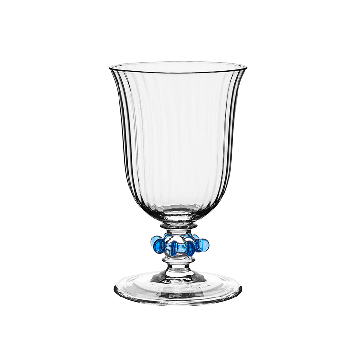 Clear glass with blue beads on a white background