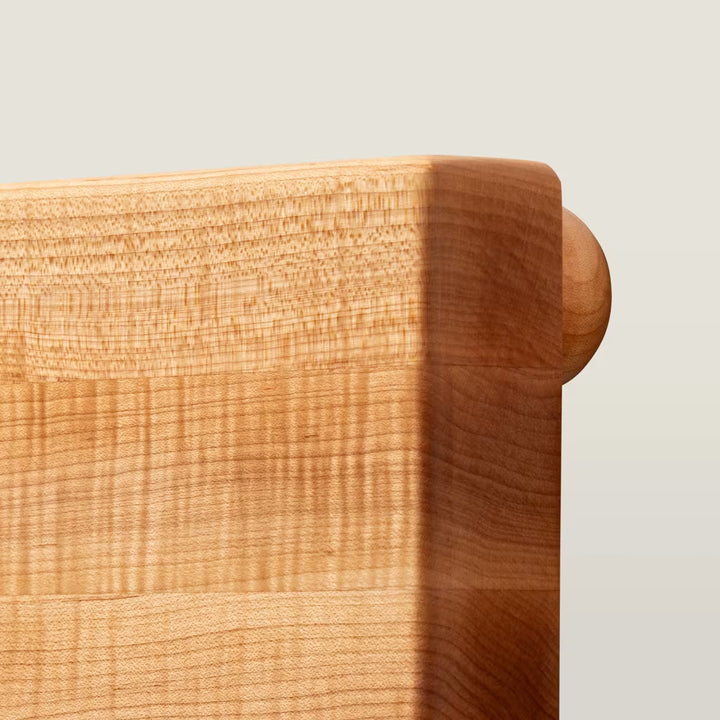 Close-up of a wooden surface with a light background