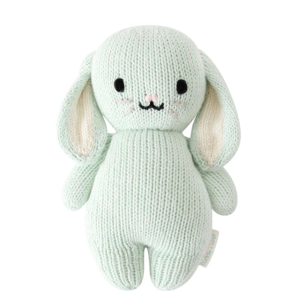 Knitted toy rabbit in a light minty green