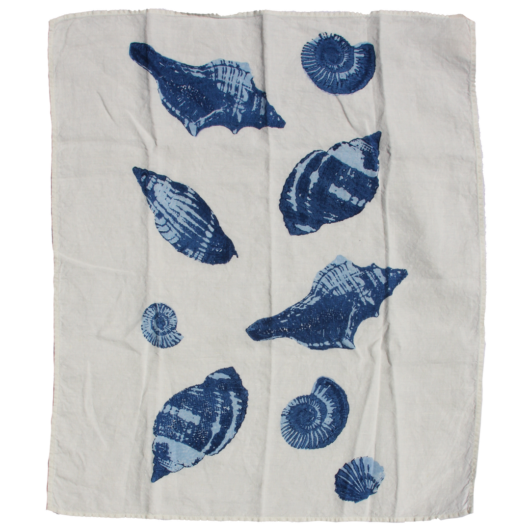 white kitchen towel with blue seashell pattern