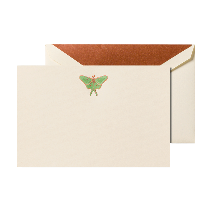 Beige card with green luna moth engraved motif and envelope with a gold liner on a white background