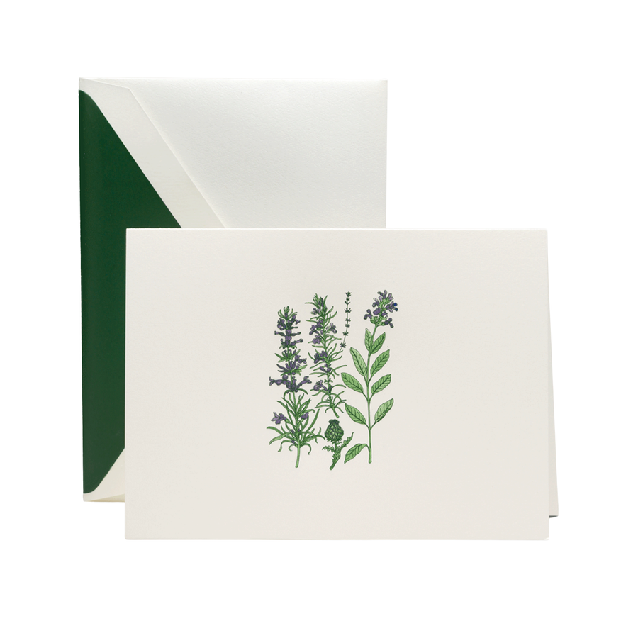 Note card with botanical design and matching green envelope on a white background