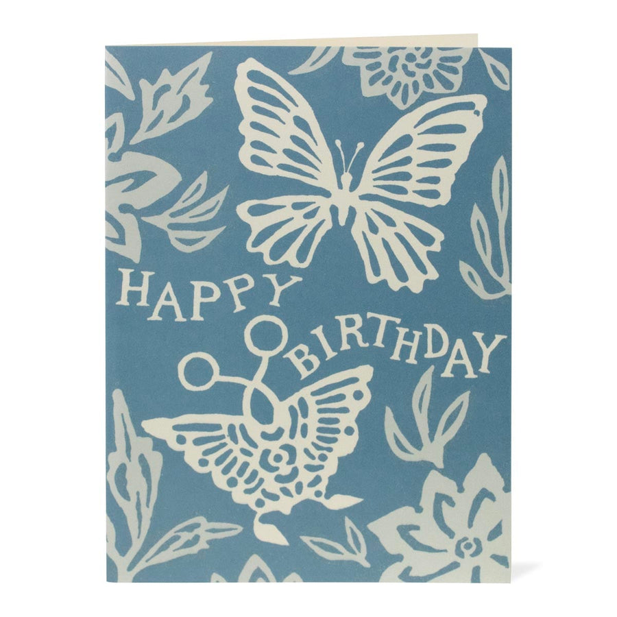 Blue birthday card with white butterfly designs and 'Happy Birthday' text