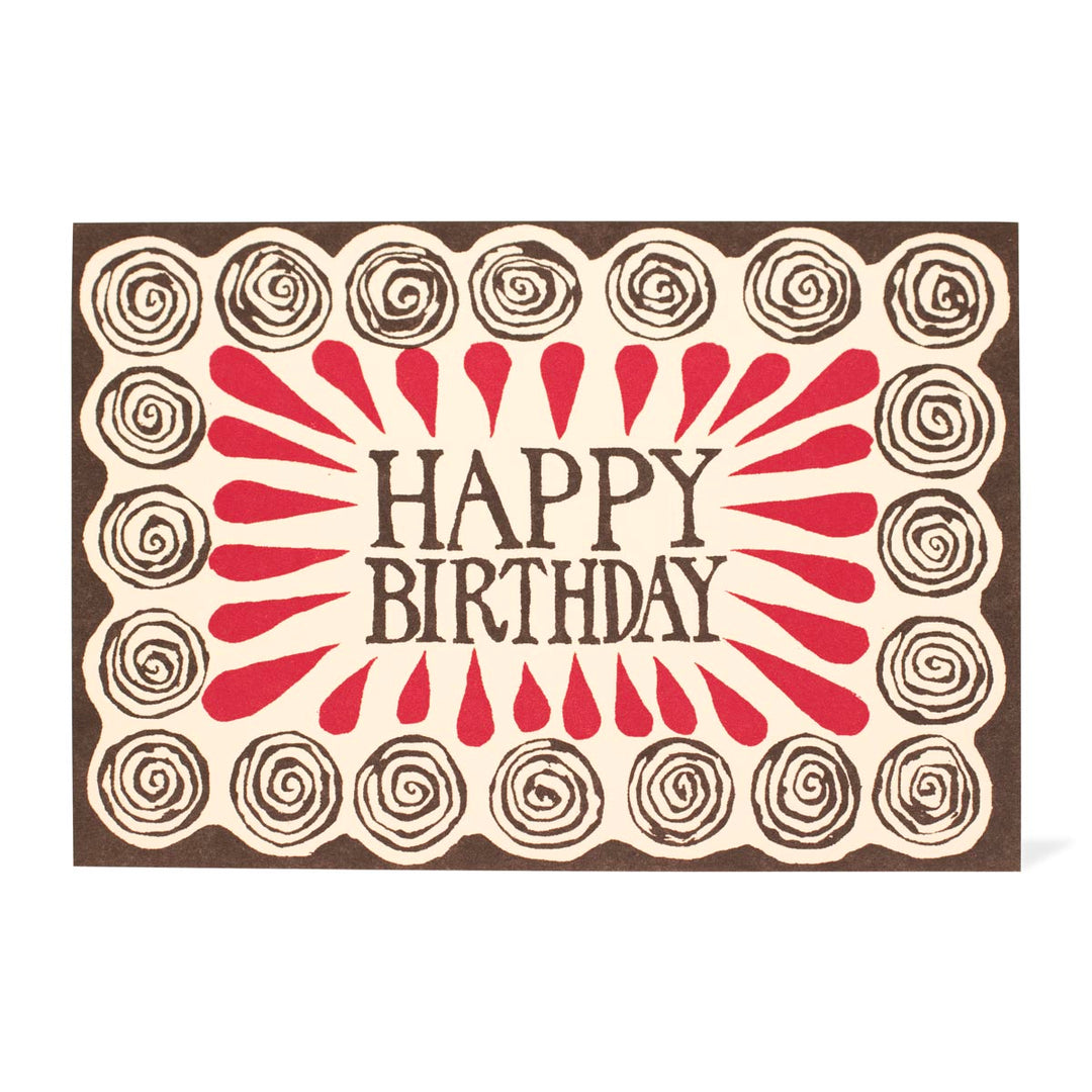 Birthday card with 'Happy Birthday' text and decorative spiral patterns on a white background
