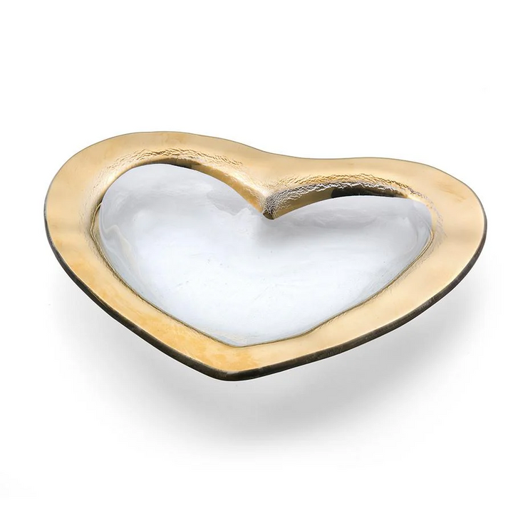 A clear glass heart shaped bowl with a gold edge 